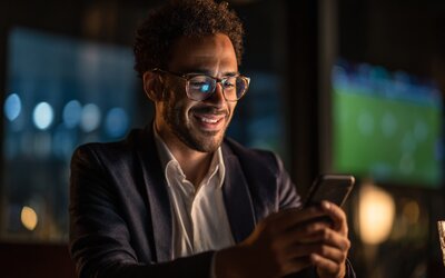 Indian Professional Using Betbarter Mobile Cricket Betting App at Home